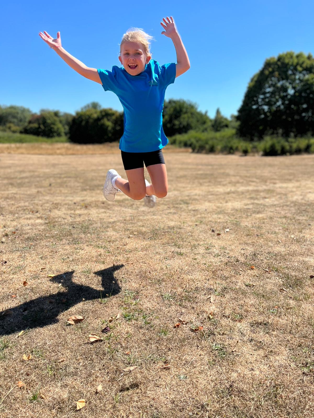 Happy child jumping for joy