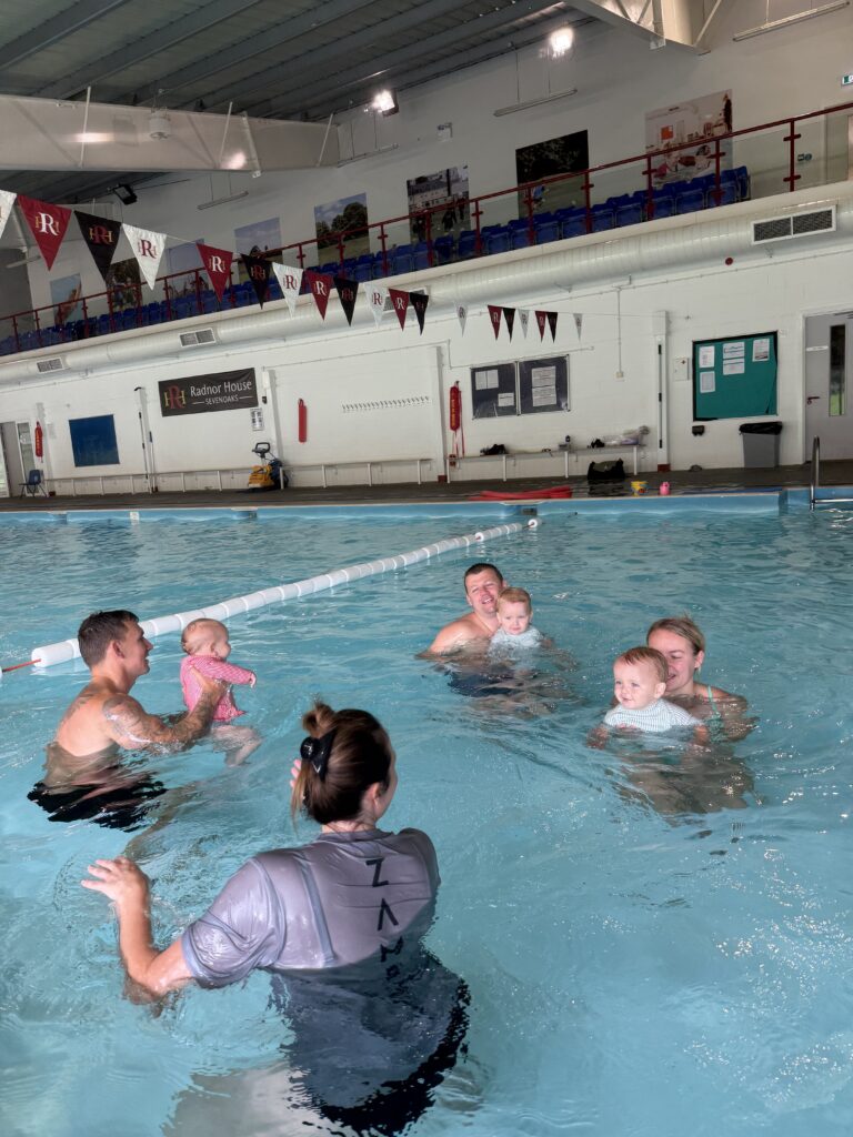 Zambezi teacher leading a parent and baby group in the pool